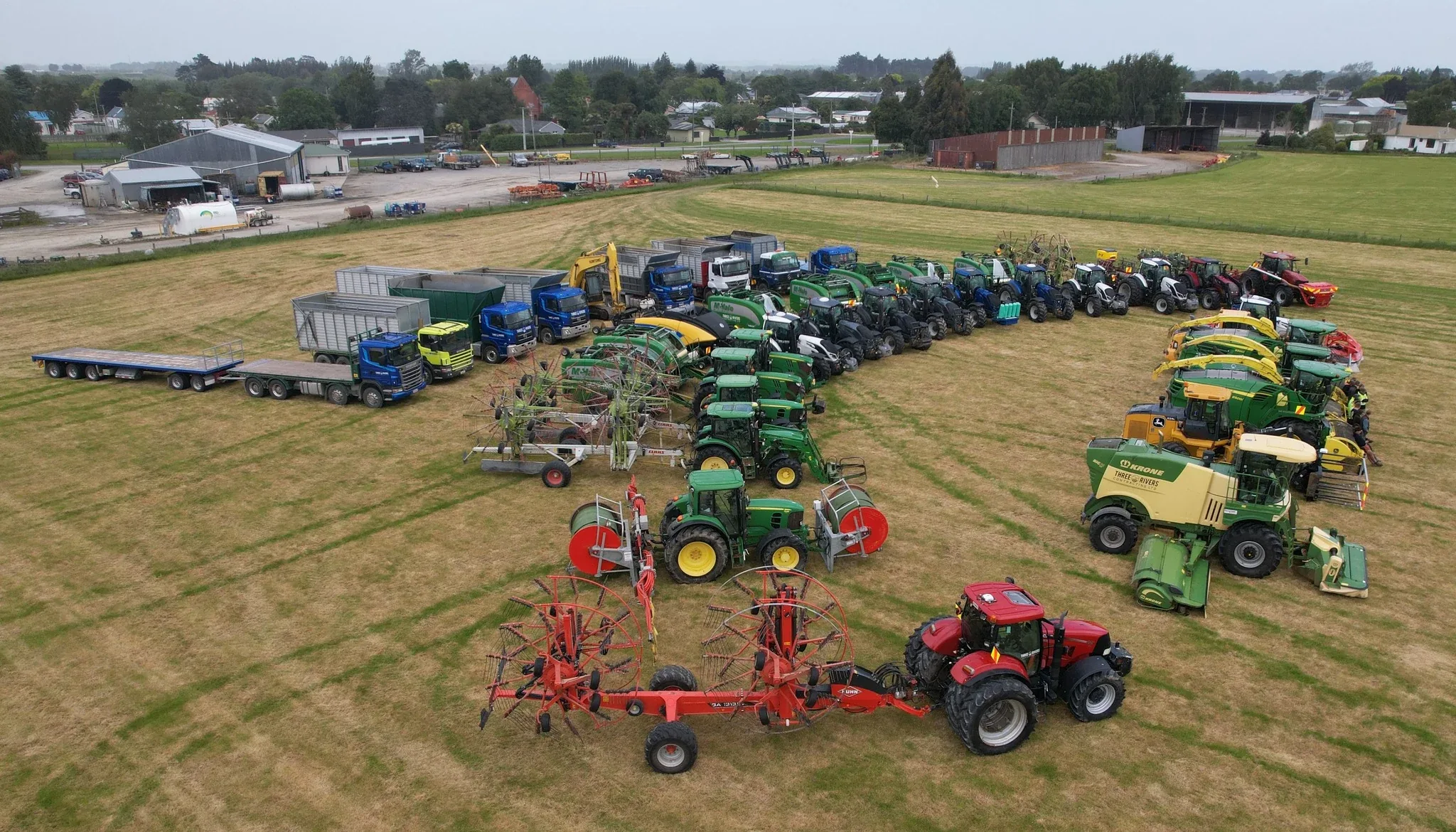 Aerial view of the Three Rivers Contracting fleet lined up in a paddock.